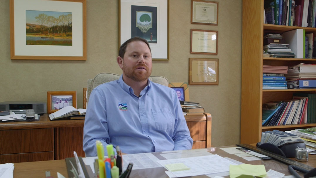 man sitting at a desk